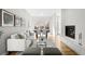 Bright living room with a cozy fireplace and an open floor plan at 33 S Ogden St, Denver, CO 80209