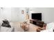 Bright living room features modern furnishings, plush seating, and a sleek entertainment setup at 33 S Ogden St, Denver, CO 80209
