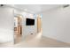 Bright room with a wall mounted television at 33 S Ogden St, Denver, CO 80209