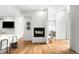 Bright, open-concept living space with fireplace, hardwood floors, and stylish modern decor at 33 S Ogden St, Denver, CO 80209