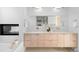 Gorgeous bathroom with a fireplace, modern vanity with double sinks, and plenty of natural light at 33 S Ogden St, Denver, CO 80209