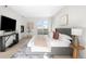 Beautiful bedroom with a gray tufted headboard, gas fireplace and sliding glass doors to a balcony at 33 S Ogden St, Denver, CO 80209