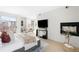 Light-filled bedroom with sliding glass doors to a balcony, fireplace and sleek modern decor at 33 S Ogden St, Denver, CO 80209