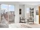 Bright bedroom with sliding glass doors to balcony, neutral furniture, and modern decor at 33 S Ogden St, Denver, CO 80209
