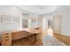 Bright office area with built-in desk, hardwood floors and ample storage cabinets at 33 S Ogden St, Denver, CO 80209