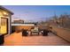 Inviting rooftop deck featuring ample seating, potted plants, and expansive city views under a serene sky at 33 S Ogden St, Denver, CO 80209