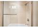 Close-up of the shower with glass door and tile, showcasing the fixtures and a mounted caddy at 33 S Ogden St, Denver, CO 80209
