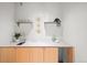 Cozy wet bar equipped with a sink, cabinets, and decorative shelving at 33 S Ogden St, Denver, CO 80209