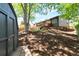 The well-maintained backyard features a large shed, multiple decks and lovely landscaping at 2184 S Braun Way, Lakewood, CO 80228