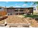 The spacious backyard has multiple decks and a garden area, perfect for outdoor relaxing and gardening at 2184 S Braun Way, Lakewood, CO 80228