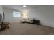 Finished basement featuring a comfortable seating area, carpet, and natural light at 2184 S Braun Way, Lakewood, CO 80228