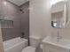 Bathroom featuring tiled shower, modern sink, and updated fixtures at 2184 S Braun Way, Lakewood, CO 80228