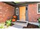 Stylish front door with brick accents and modern planter boxes at the entry at 2184 S Braun Way, Lakewood, CO 80228