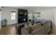 Cozy living room with a fireplace, large television, and comfortable seating area at 2184 S Braun Way, Lakewood, CO 80228
