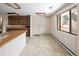 Bright eat-in kitchen features wooden cabinets and a large window for plenty of light at 3860 Dudley St, Wheat Ridge, CO 80033