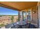 Relaxing balcony with table and chairs overlooking a mountain view at 9351 Viaggio Way, Highlands Ranch, CO 80126