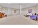 Large basement space with carpeted floor, white walls, recessed lighting and sitting area at 9351 Viaggio Way, Highlands Ranch, CO 80126