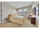 Bright bedroom with neutral tones and window for natural light at 9351 Viaggio Way, Highlands Ranch, CO 80126