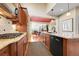 Well-equipped kitchen with gas range and granite countertops open to the dining area at 9351 Viaggio Way, Highlands Ranch, CO 80126