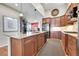 Spacious kitchen with stainless steel refrigerator, extensive counter space and abundant cabinets at 9351 Viaggio Way, Highlands Ranch, CO 80126