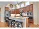 Gourmet kitchen featuring a large island, double ovens, and custom cabinetry at 9351 Viaggio Way, Highlands Ranch, CO 80126