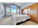 Well-lit main bedroom features a large window and built-in wardrobe at 9351 Viaggio Way, Highlands Ranch, CO 80126