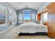 Bright main bedroom with built-in storage and a view of the landscape at 9351 Viaggio Way, Highlands Ranch, CO 80126