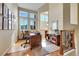 Bright office area with a large window, desk and staircase access at 9351 Viaggio Way, Highlands Ranch, CO 80126