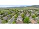 Panoramic aerial view of residential area showing rooftops, surrounding greenery, and lake in the distance at 9631 S Dover Way, Littleton, CO 80127