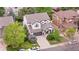 A home's aerial view showcasing its well-kept yard, neutral siding and convenient two-car garage at 9631 S Dover Way, Littleton, CO 80127