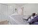 Well-lit bedroom showcasing a comfortable bed and simple decor at 9631 S Dover Way, Littleton, CO 80127