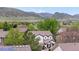 An exterior shot that shows the home backed by beautiful mountain views at 9631 S Dover Way, Littleton, CO 80127