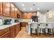 Well-equipped kitchen with granite countertops, cherry cabinets, and stainless steel appliances at 9631 S Dover Way, Littleton, CO 80127
