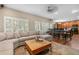 Comfortable living room showcasing an open-concept layout that flows seamlessly into the kitchen area at 9631 S Dover Way, Littleton, CO 80127