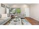 Comfortable living room with neutral tones, plush seating, and bright windows with nice trim at 9631 S Dover Way, Littleton, CO 80127