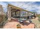 Outdoor patio area with dining set, built-in seating, and a well-maintained yard at 14969 Elsinore Ave, Parker, CO 80134