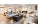 Spacious basement with a fireplace, comfortable seating, and stylish decor at 14969 Elsinore Ave, Parker, CO 80134