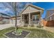 Beautiful home with stone accents, a three-car garage, and a cozy front porch at 14969 Elsinore Ave, Parker, CO 80134