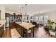 Open-concept kitchen and living area featuring hardwood floors, modern decor and great natural light at 14969 Elsinore Ave, Parker, CO 80134