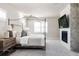 Luxurious main bedroom with a large canopy bed and fireplace at 1125 Brotherton Pt, Castle Rock, CO 80104