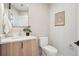 Elegant half bathroom featuring a vanity, marble countertop, and modern fixtures at 2330 Eliot St # 2, Denver, CO 80211