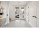 Bright foyer features tile flooring, white doors, and a view of the exterior at 2330 Eliot St # 2, Denver, CO 80211