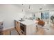 Well-lit kitchen featuring a central island with bar seating and stainless steel appliances at 2330 Eliot St # 2, Denver, CO 80211