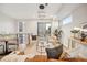 Bright living room featuring modern lighting, a cozy sofa, and access to a balcony through sliding glass doors at 2330 Eliot St # 2, Denver, CO 80211