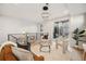 Bright living room featuring modern lighting, a cozy sofa, and access to a balcony through sliding glass doors at 2330 Eliot St # 2, Denver, CO 80211