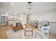 Open-concept living room with modern kitchen, stylish furnishings, and contemporary light fixture at 2330 Eliot St # 2, Denver, CO 80211