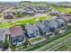 An aerial view of houses with a park and walking path in the distance at 3325 Umber Cir, Castle Rock, CO 80109