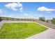 A green backyard featuring a wooden fence and gravel at 3325 Umber Cir, Castle Rock, CO 80109