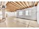 Spacious unfinished basement with two windows letting in natural light at 3325 Umber Cir, Castle Rock, CO 80109