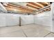 Unfinished basement with concrete floors, white plastic lined walls, and exposed beam ceilings at 3325 Umber Cir, Castle Rock, CO 80109